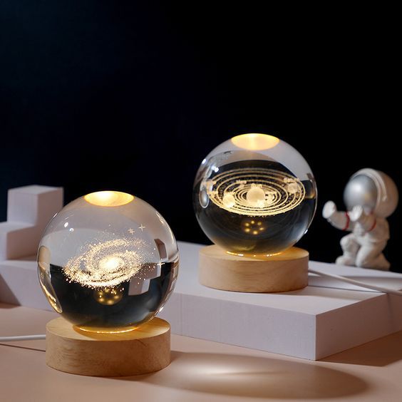 Beautiful 3D Crystal Ball LED Table Lamp With Laser Engraved Solar System Or Galaxy Design On Wooden Base (Random Design)