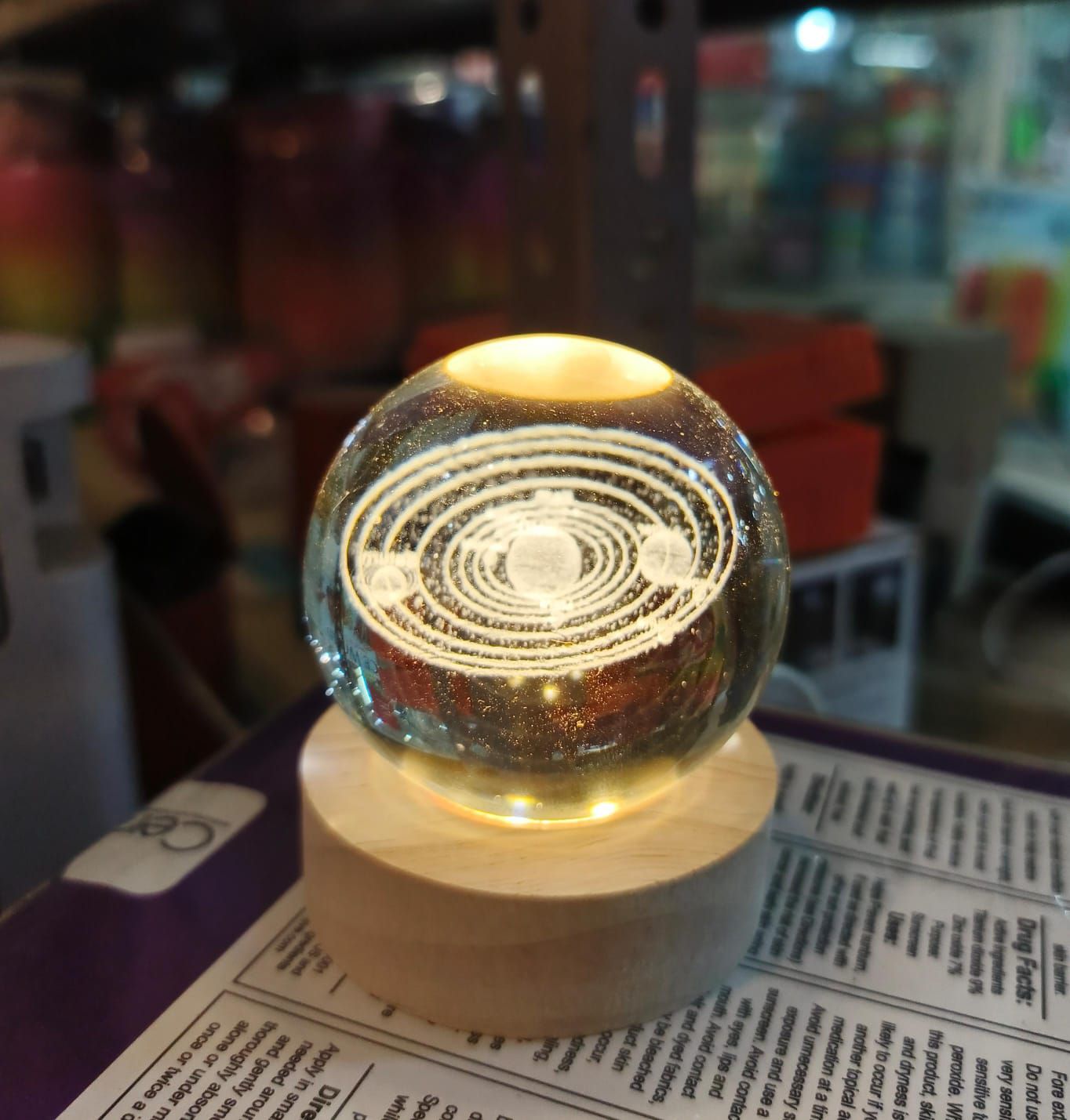 Beautiful 3D Crystal Ball LED Table Lamp With Laser Engraved Solar System Or Galaxy Design On Wooden Base (Random Design)